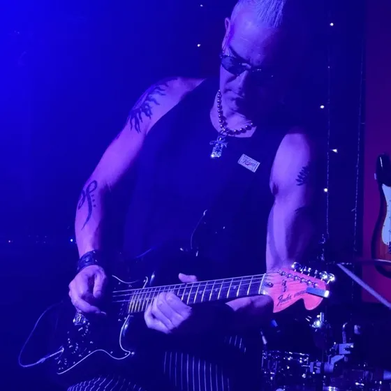 Rik Avalos in blue stage light